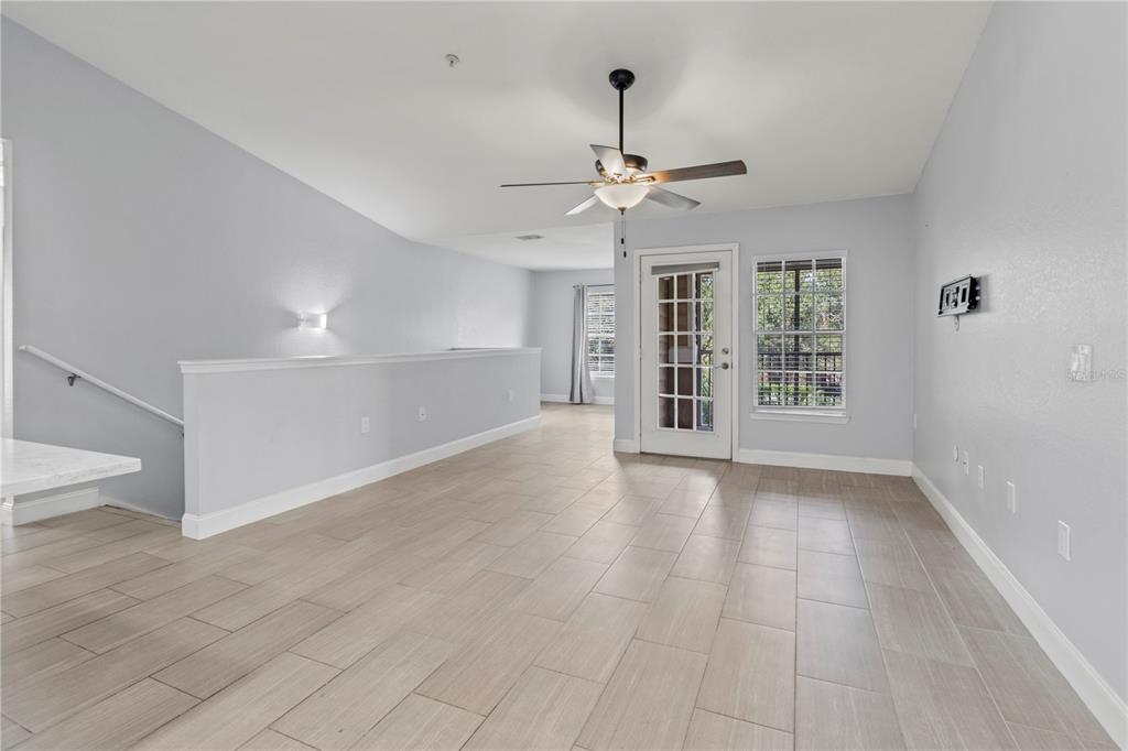 8911 Manor Loop, Unit 204 Lakewood Ranch, FL 34202 - Photo 18 of 45 an empty room with windows and fan