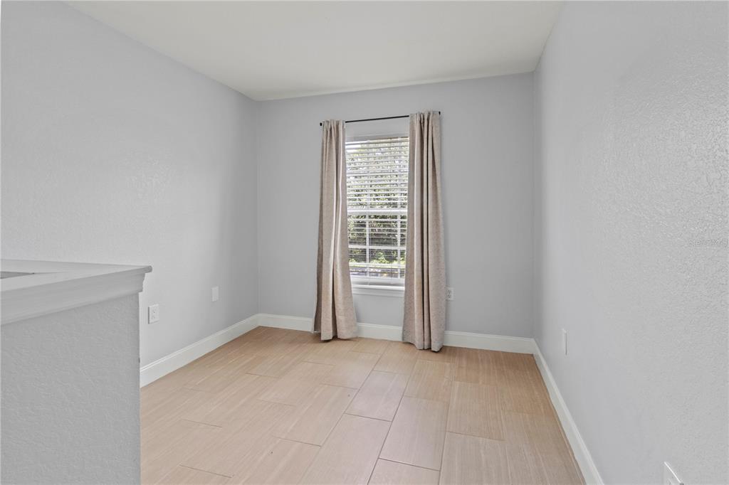 8911 Manor Loop, Unit 204 Lakewood Ranch, FL 34202 - Photo 19 of 45 a view of an empty room with a window