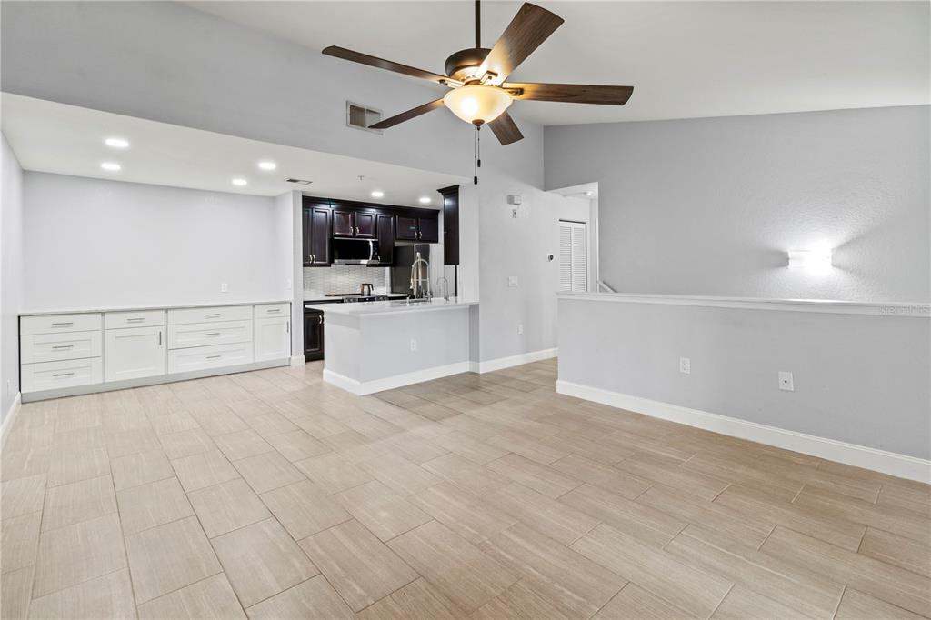 8911 Manor Loop, Unit 204 Lakewood Ranch, FL 34202 - Photo 32 of 45 a view of a kitchen with a sink and a refrigerator