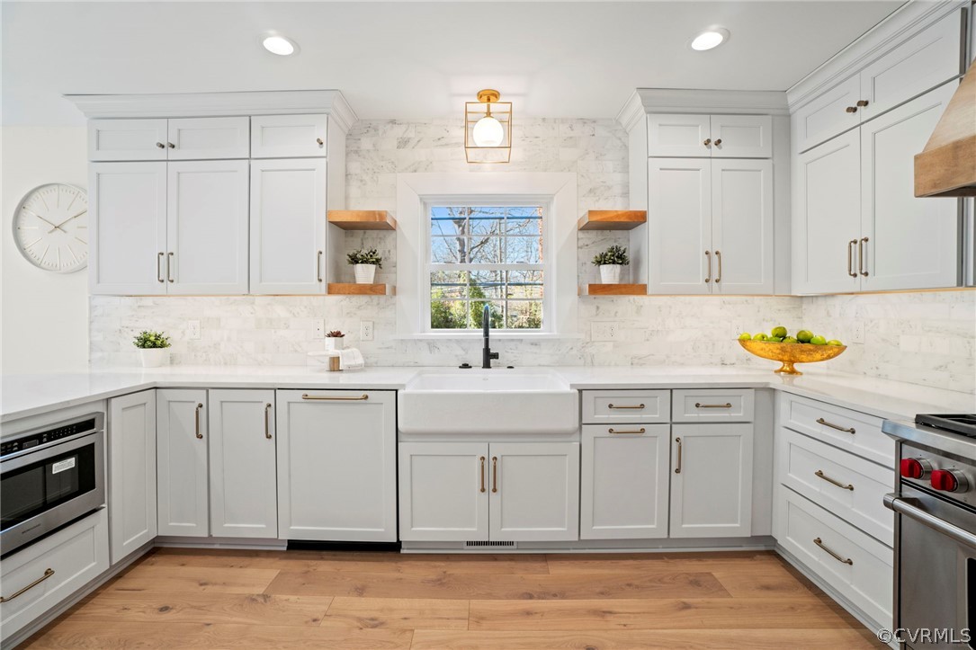 200 North Ridge Road Henrico, VA 23229 - Photo 13 of 48 a kitchen with white cabinets and sink