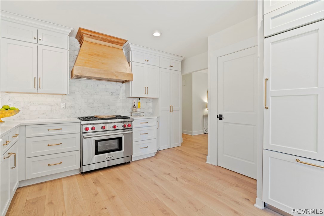 200 North Ridge Road Henrico, VA 23229 - Photo 14 of 48 a kitchen with stainless steel appliances white cabinets and wooden floors