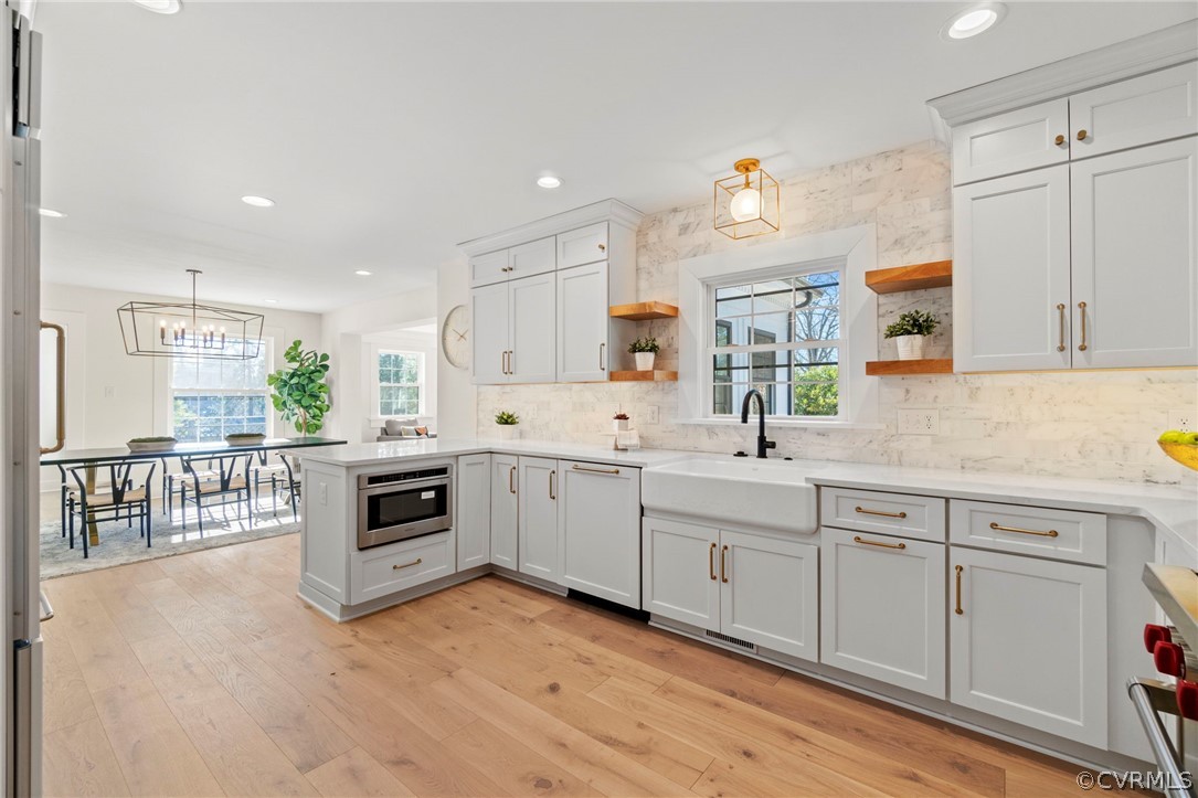 200 North Ridge Road Henrico, VA 23229 - Photo 16 of 48 a kitchen with white cabinets and white appliances