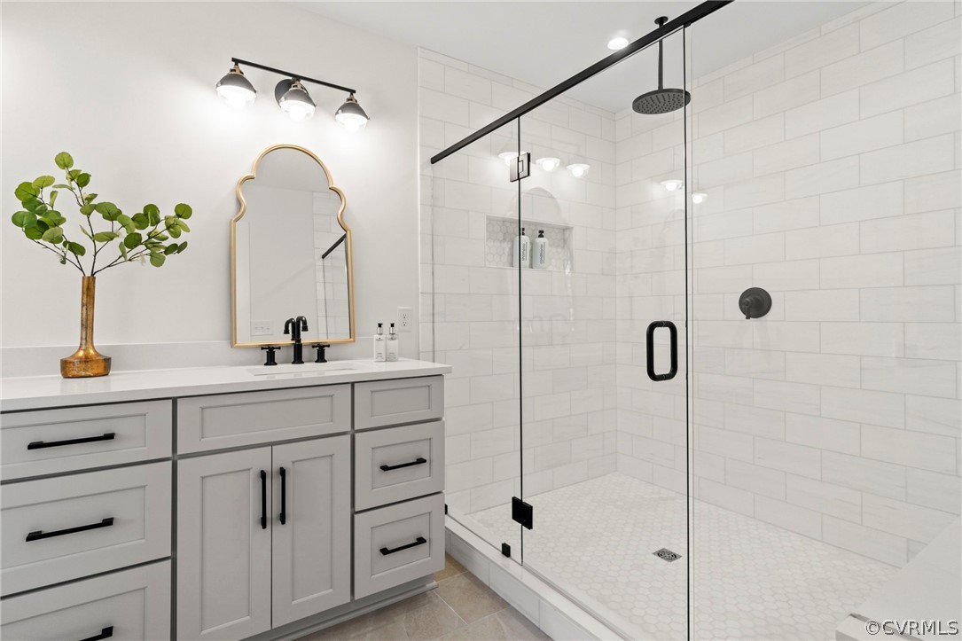 200 North Ridge Road Henrico, VA 23229 - Photo 26 of 48 a bathroom with a shower sink and mirror