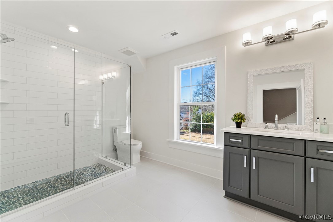 200 North Ridge Road Henrico, VA 23229 - Photo 33 of 48 a spacious bathroom with a shower sink and mirror