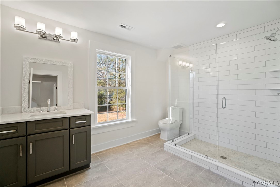200 North Ridge Road Henrico, VA 23229 - Photo 37 of 48 a bathroom with a shower sink and mirror
