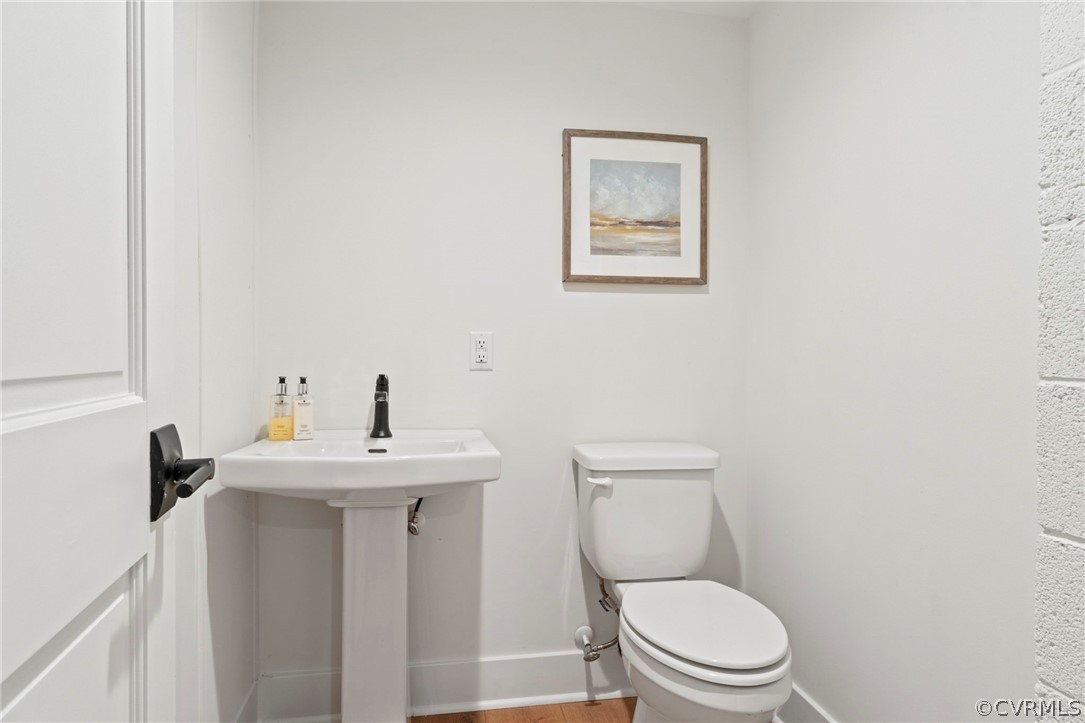 200 North Ridge Road Henrico, VA 23229 - Photo 43 of 48 a bathroom with a toilet a sink and mirror