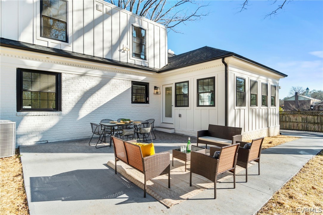 200 North Ridge Road Henrico, VA 23229 - Photo 45 of 48 a view of a patio with couches table and chairs with wooden floor and fence