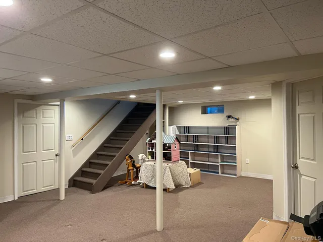 a view of an empty room and stairs