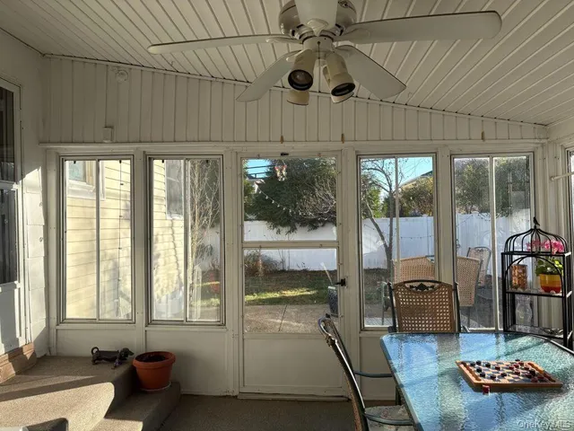 a room with furniture and a large window