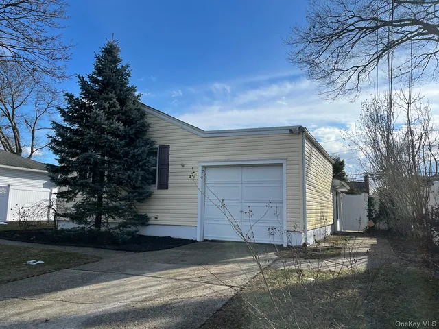 a small white house with a outdoor space