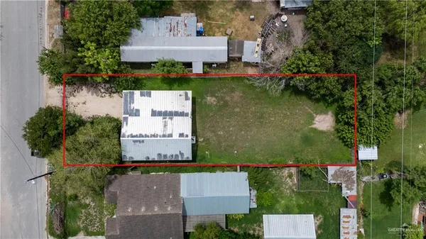 an aerial view of a house with a garden