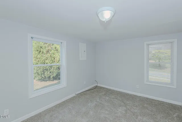 an empty room with windows