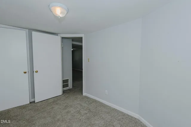 a bathroom with a granite countertop sink toilet a mirror and shower
