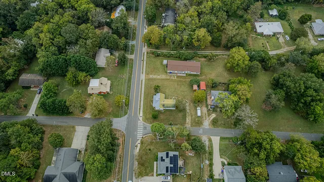 an aerial view of residential house with outdoor space