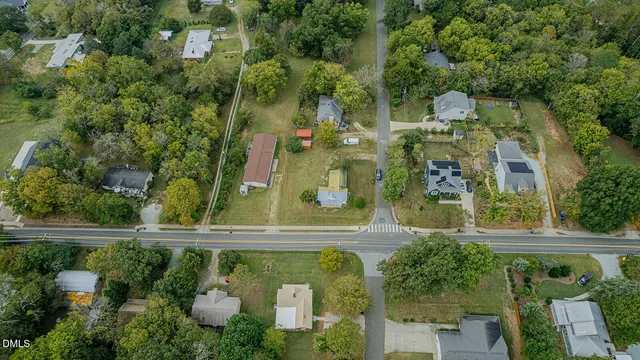 a view of a balcony with chair and wooden floor