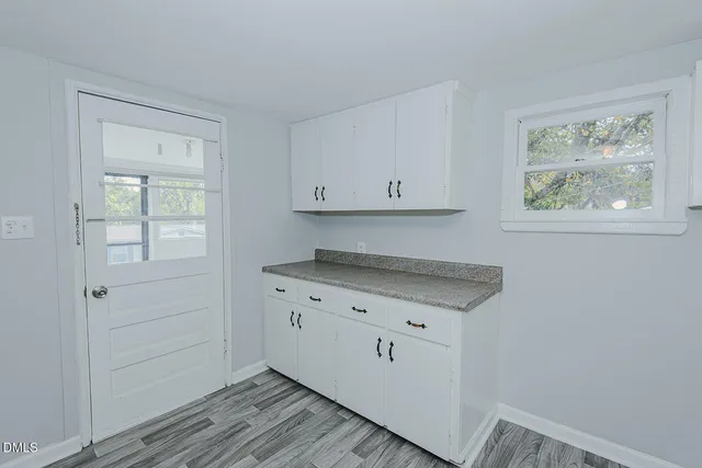 a view of cabinets and wooden floor