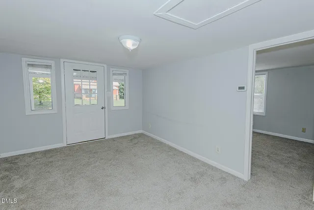 an empty room with windows