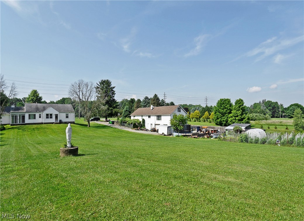 14077 Alexander Road Bedford, OH 44146 - Photo 30 of 31 Neighbor has a large, fenced, immaculately maintained garden.