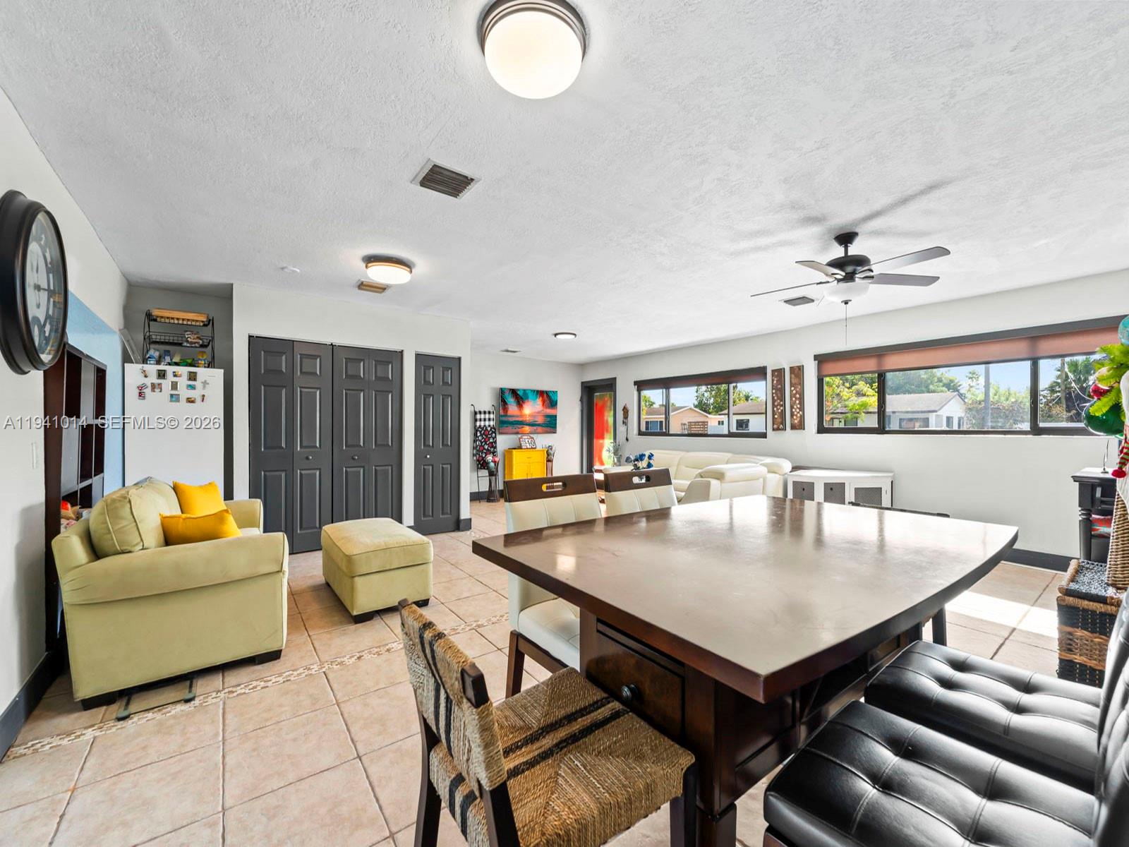 12301 Southwest 28th Street Miami, FL 33175 - Photo 11 of 46 a living room with furniture and a table