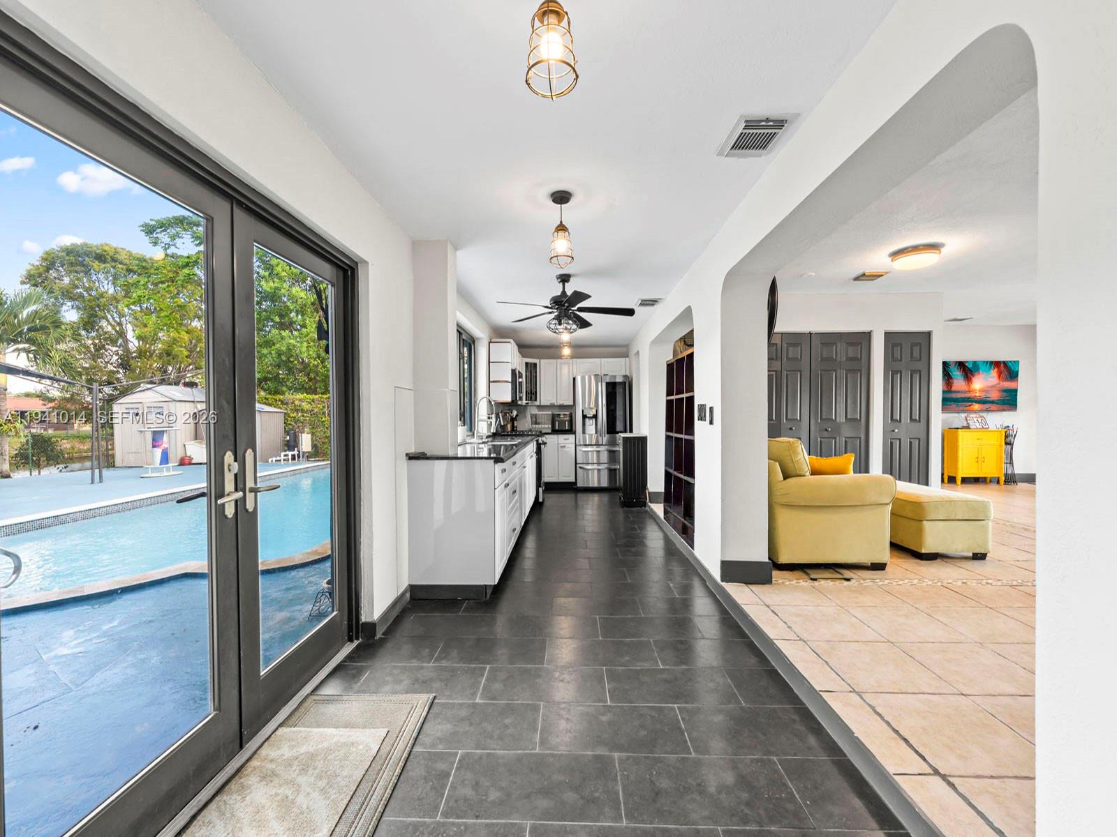 12301 Southwest 28th Street Miami, FL 33175 - Photo 12 of 46 a lobby with furniture and a chandelier