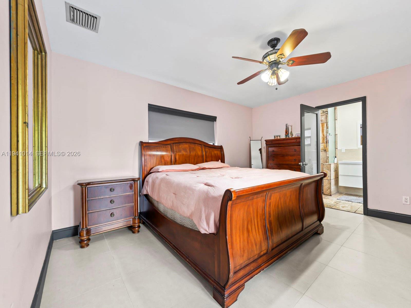 12301 Southwest 28th Street Miami, FL 33175 - Photo 15 of 46 a bedroom with a bed and window