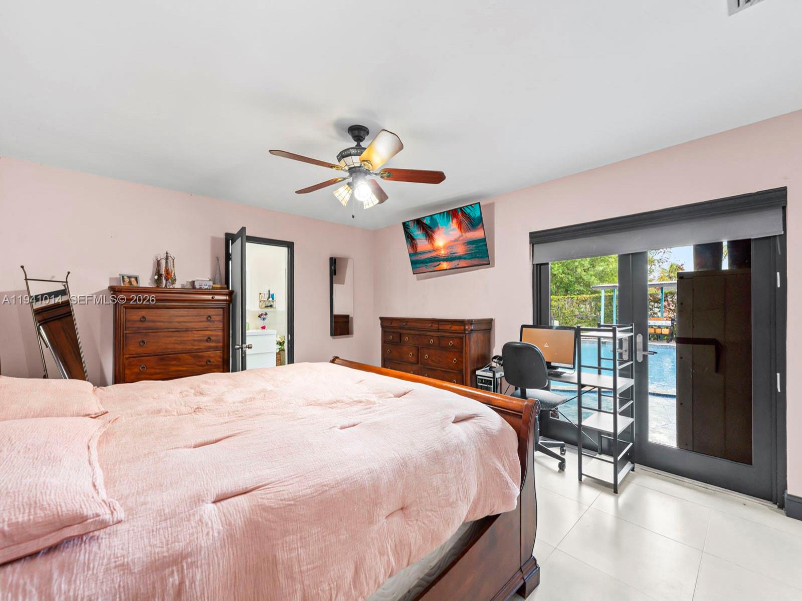 12301 Southwest 28th Street Miami, FL 33175 - Photo 16 of 46 a bed room with a bed and a chair