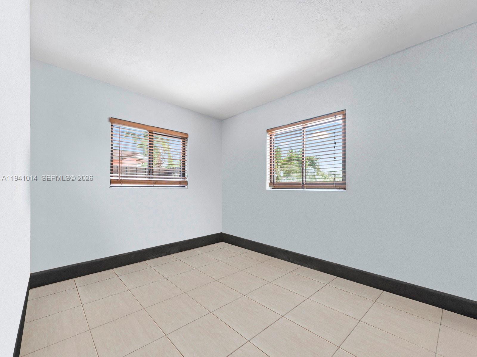 12301 Southwest 28th Street Miami, FL 33175 - Photo 21 of 46 a view of an empty room with a window