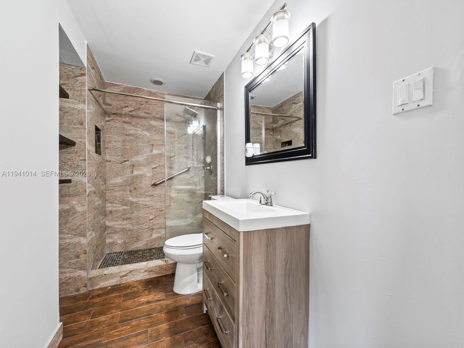 12301 Southwest 28th Street Miami, FL 33175 - Photo 22 of 46 a bathroom with a toilet and a sink