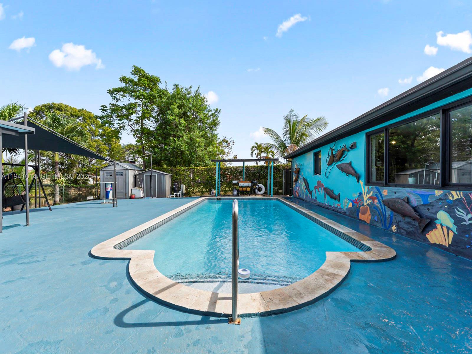 12301 Southwest 28th Street Miami, FL 33175 - Photo 25 of 46 swimming pool view with a seating space