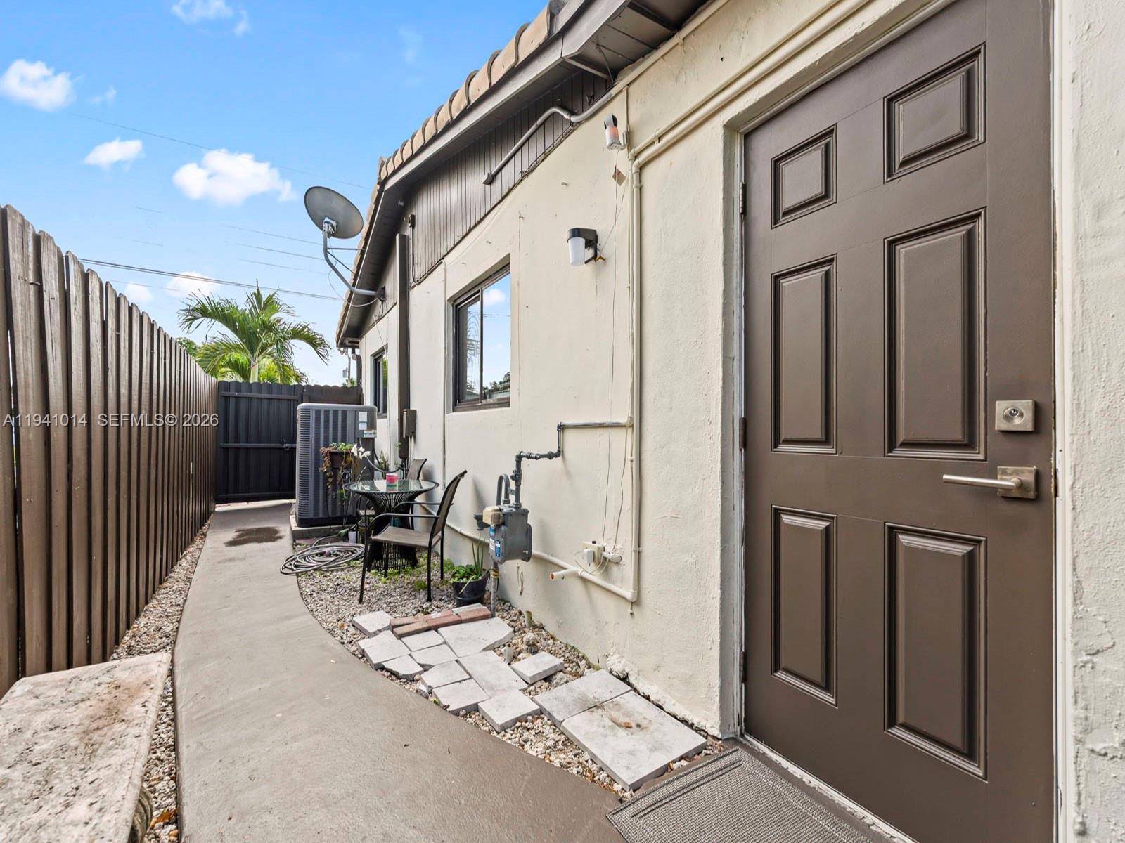 12301 Southwest 28th Street Miami, FL 33175 - Photo 29 of 46 a patio with table and chairs