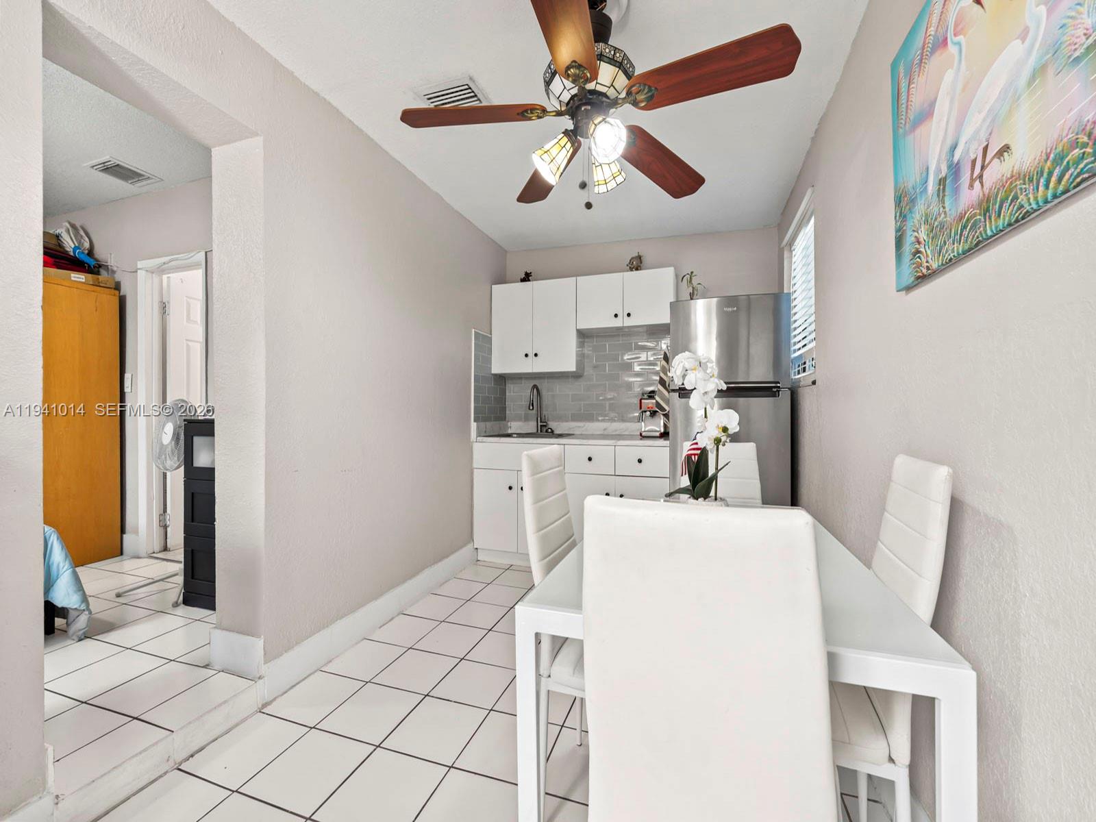 12301 Southwest 28th Street Miami, FL 33175 - Photo 31 of 46 a view of kitchen with furniture and refrigerator