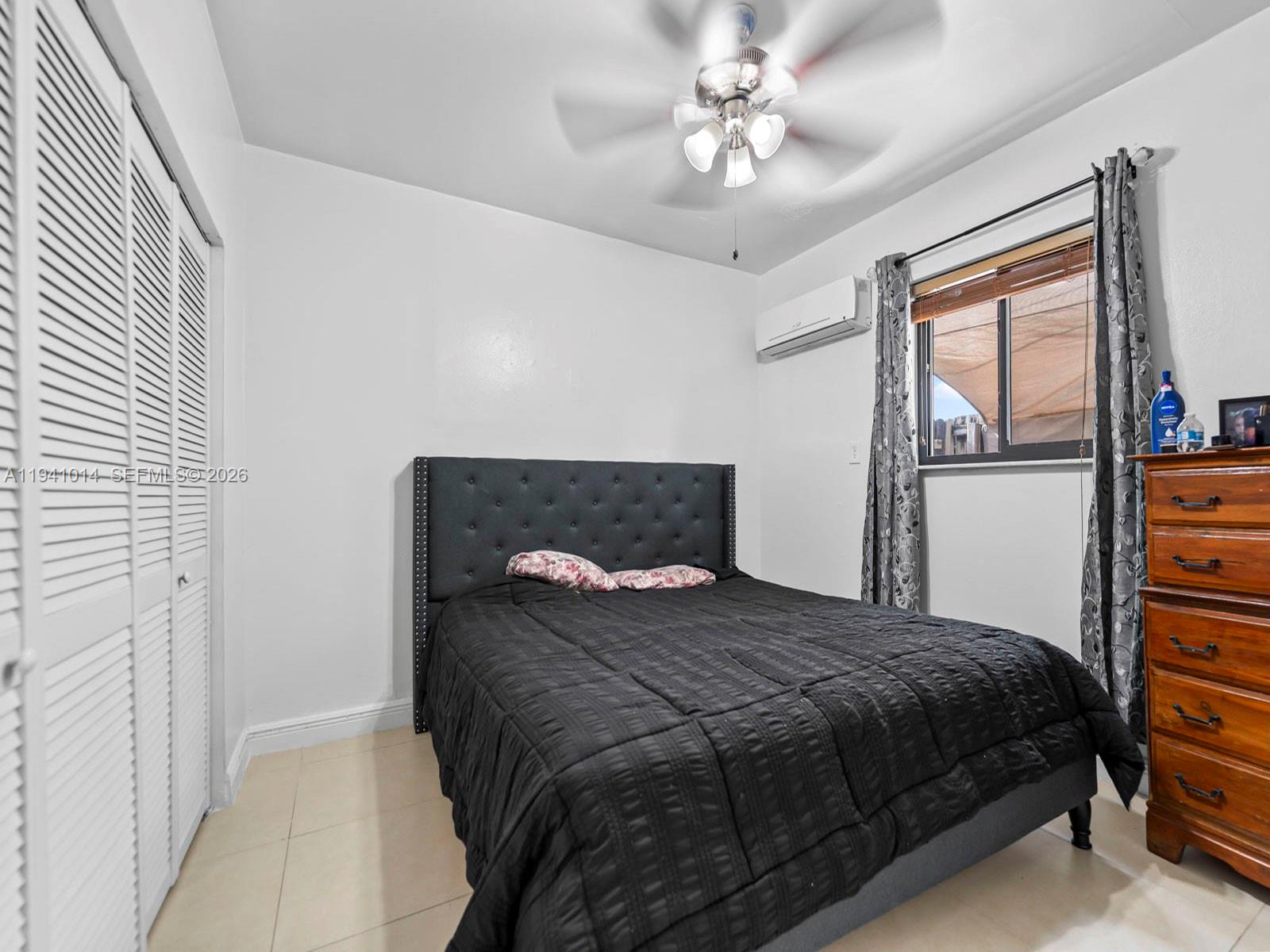 12301 Southwest 28th Street Miami, FL 33175 - Photo 38 of 46 a bedroom with a bed and a window