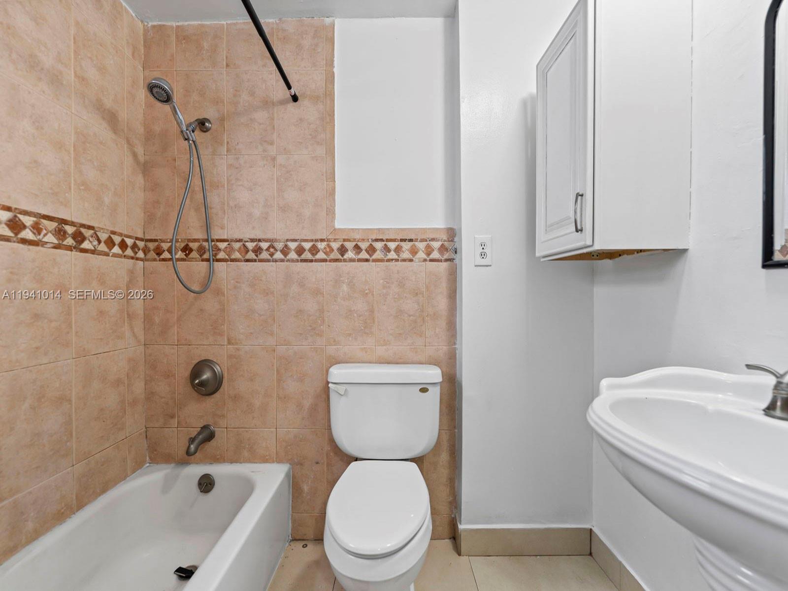 12301 Southwest 28th Street Miami, FL 33175 - Photo 40 of 46 a bathroom with a toilet a sink and bathtub