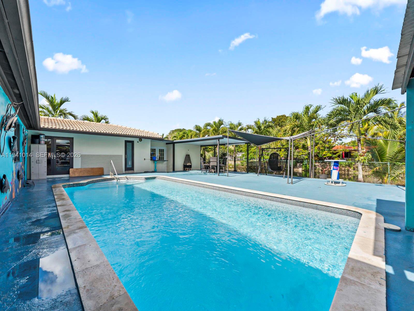 12301 Southwest 28th Street Miami, FL 33175 - Photo 4 of 46 a view of a house with a swimming pool
