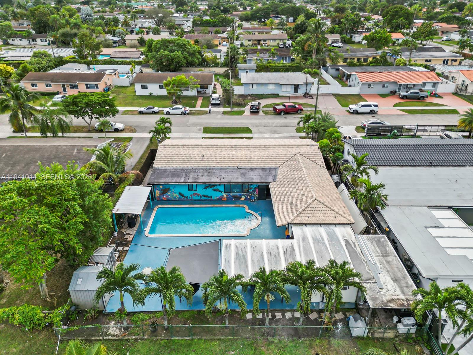 12301 Southwest 28th Street Miami, FL 33175 - Photo 44 of 46 an aerial view of a tennis ground and a cars park side of the road
