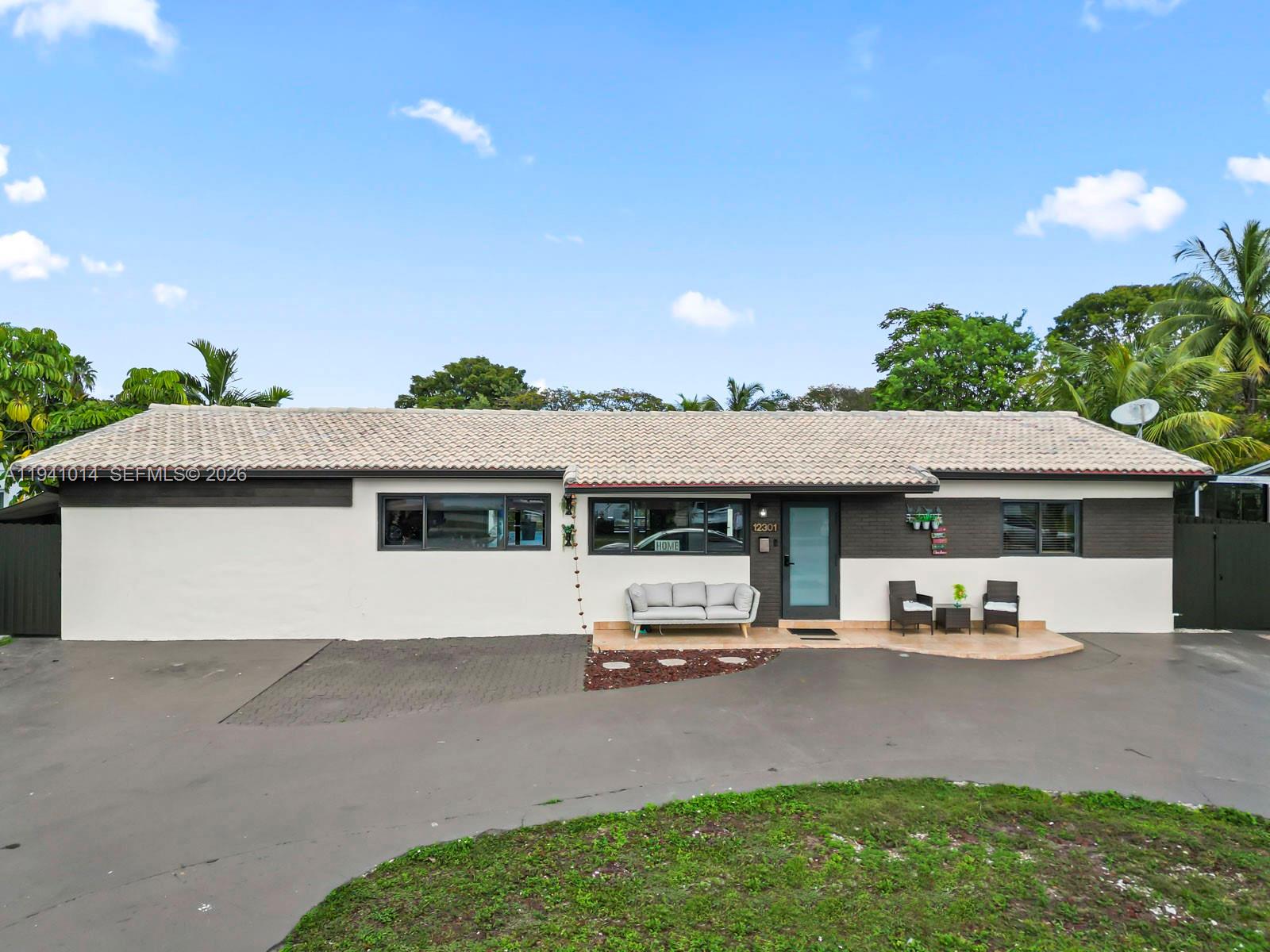 12301 Southwest 28th Street Miami, FL 33175 - Photo 6 of 46 a house view with a garden space