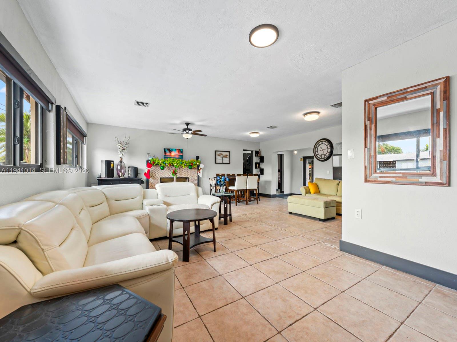 12301 Southwest 28th Street Miami, FL 33175 - Photo 8 of 46 a living room with furniture and a table