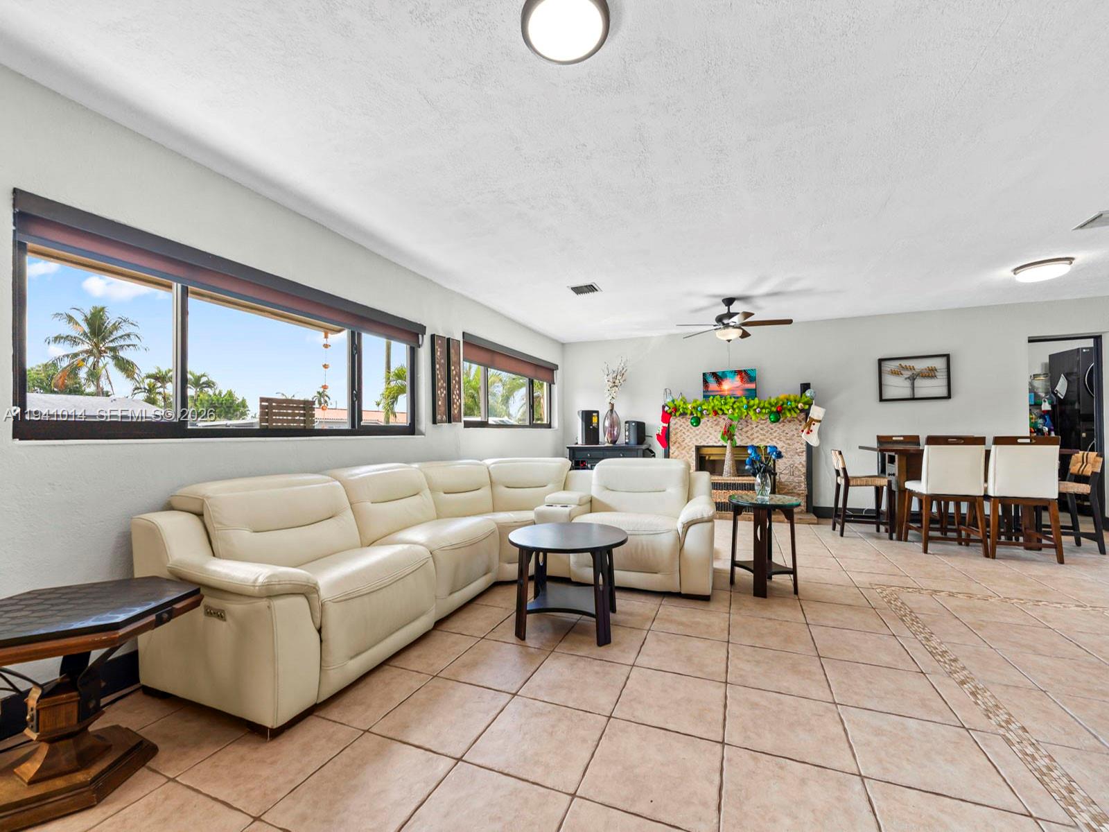 12301 Southwest 28th Street Miami, FL 33175 - Photo 9 of 46 a living room with furniture and a large window