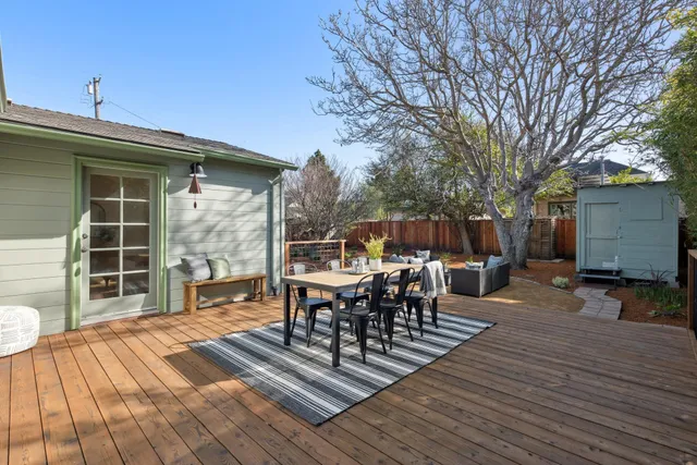 a view of a patio with a table and chairs