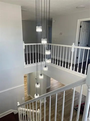a bathroom with a granite countertop sink mirror and shower