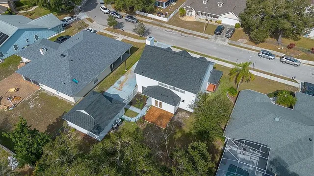 an aerial view of residential houses with outdoor space