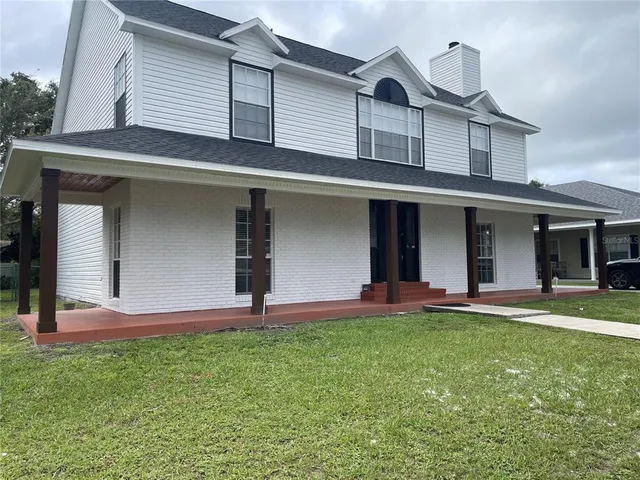 front view of a house with a yard