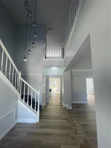a view of an entryway with wooden floor