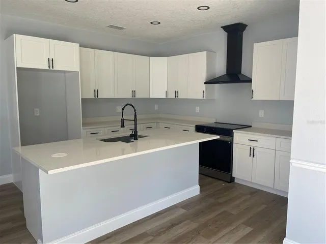 a white bath tub sitting in a kitchen