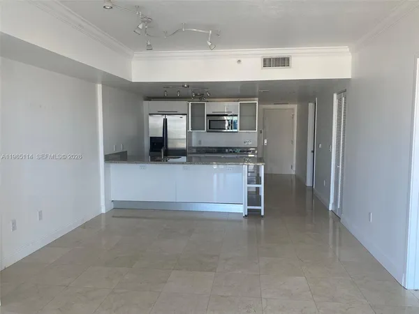 a view of kitchen and kitchen with furniture