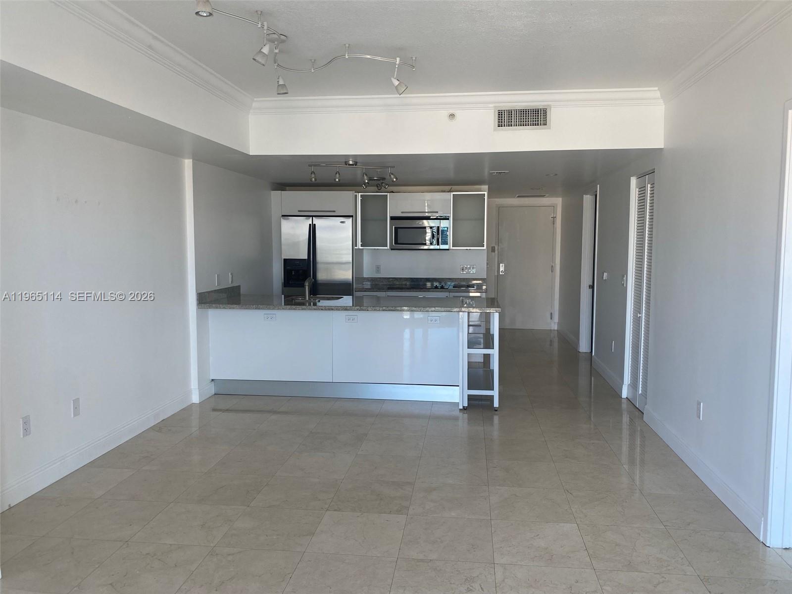 185 Southwest 7th Street, Unit 1705 Miami, FL 33130 - Photo 2 of 7 a view of kitchen and kitchen with furniture