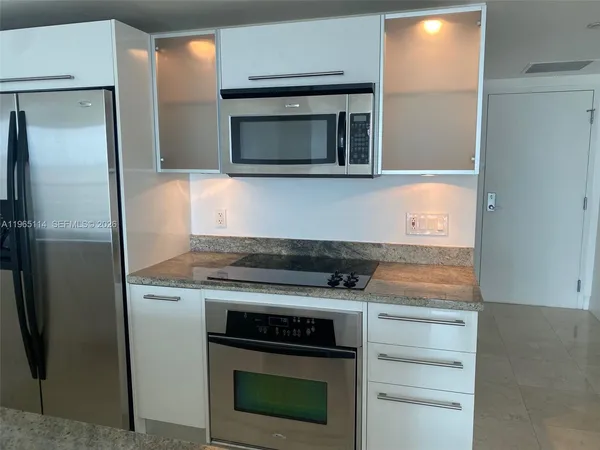 a kitchen with a stove and a microwave