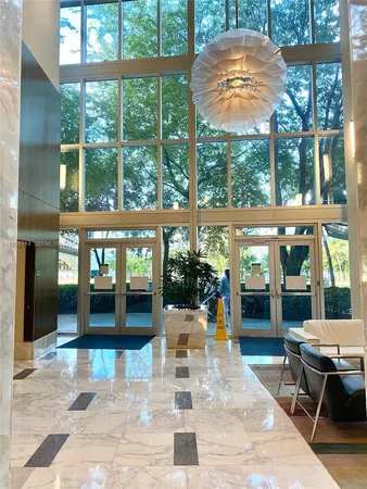 a view of a patio with a table and chairs