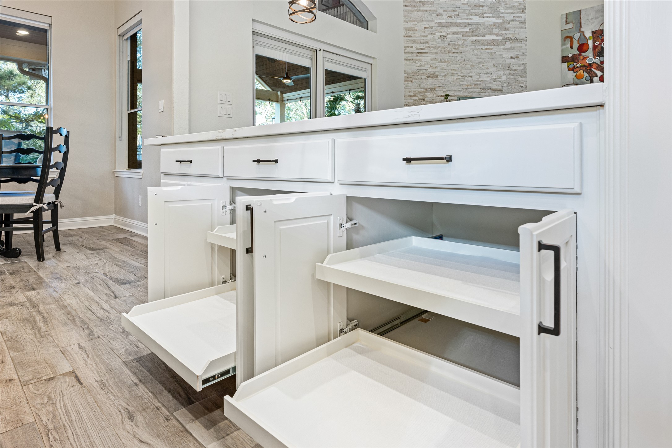 22806 2 Rivers Lane Katy, TX 77450 - Photo 25 of 49 Kitchen cabinetry includes premium pull-out drawers and shelving, providing easy access and highly efficient storage for cookware, pantry items, and small appliances-designed for both convenience and organization.