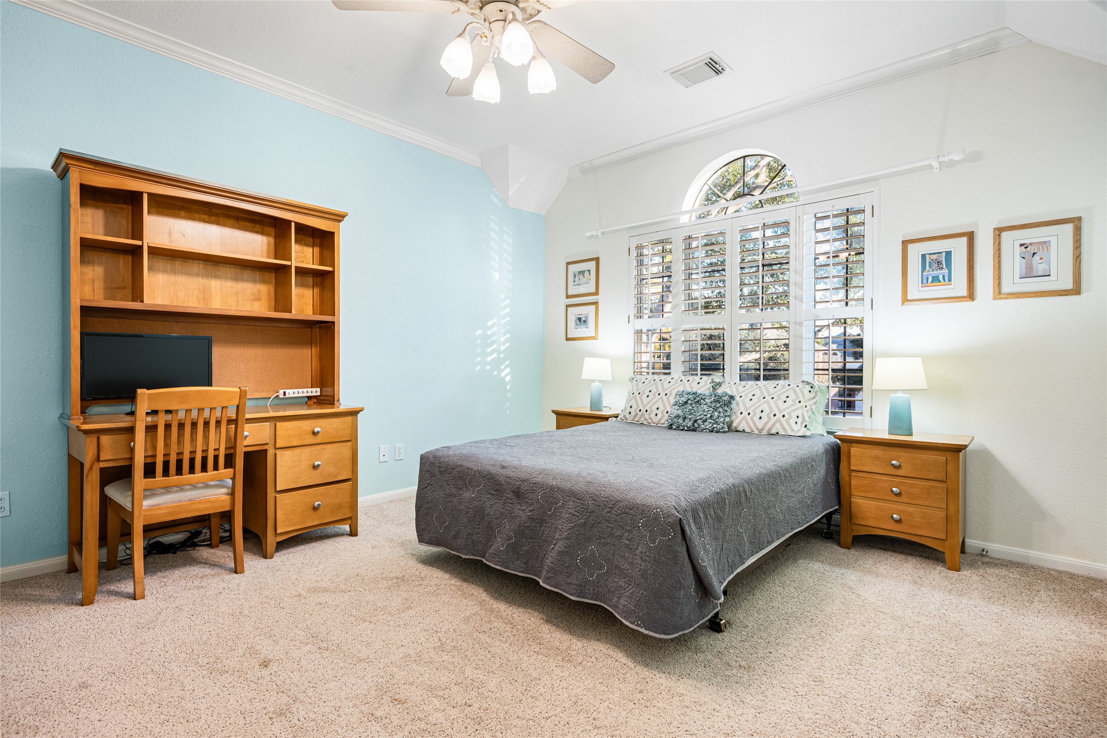 22806 2 Rivers Lane Katy, TX 77450 - Photo 37 of 49 This generously sized secondary bedroom features crown molding, custom plantation shutters and ample sized walk-in closet that provides beautiful natural light and privacy. The room is neat, inviting, and includes a private ensuite bathroom, making it ideal for guests, family or a private retreat.